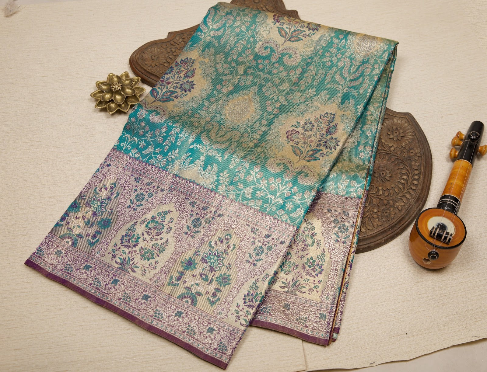 Peacock Green Kanjeevaram Tissue Silk Saree with Floral Zari Weave & Purple Floral Border