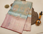 Teal Blue Kanjeevaram Tissue Silk Saree with Floral Zari Weave & Pink Floral Border