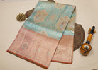 Teal Blue Kanjeevaram Tissue Silk Saree with Floral Zari Weave & Orange-Gold Broad Border