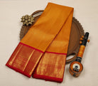 Mustard Yellow Pure Handloom Kanjeevaram Silk Saree with Zari Checks, Buttas & Pink Peacock Border