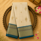Half White Silk Saree with Gold Zari Motifs & Teal Blue Border