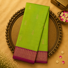 Bright Green Silk Saree with Gold-Toned Zari Motifs and Pink and Gold Traditional Border